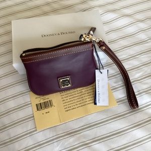 Dooney and Bourke wristlet, smooth leather, plum wine.